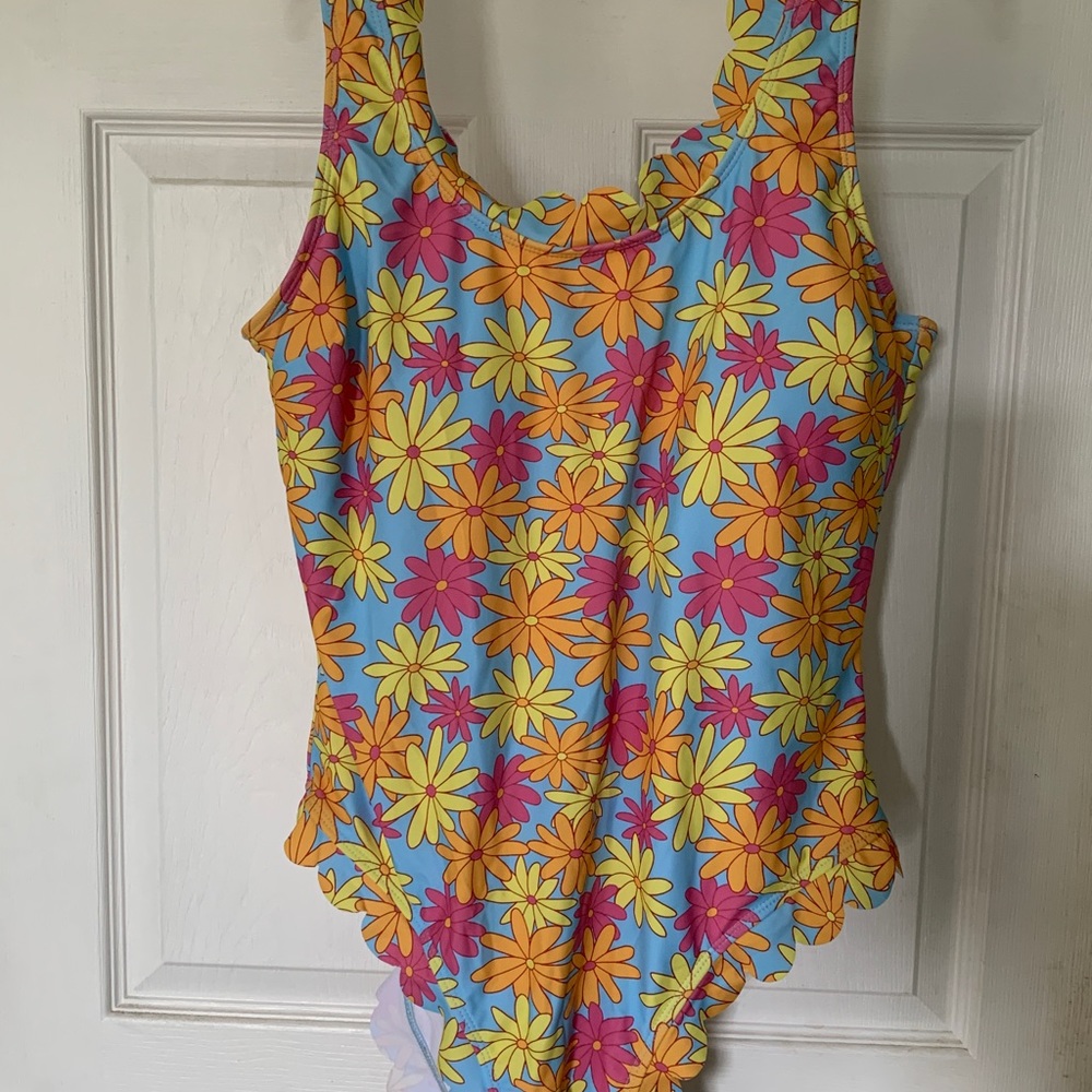 Adorable one piece with floral print. NWOT.